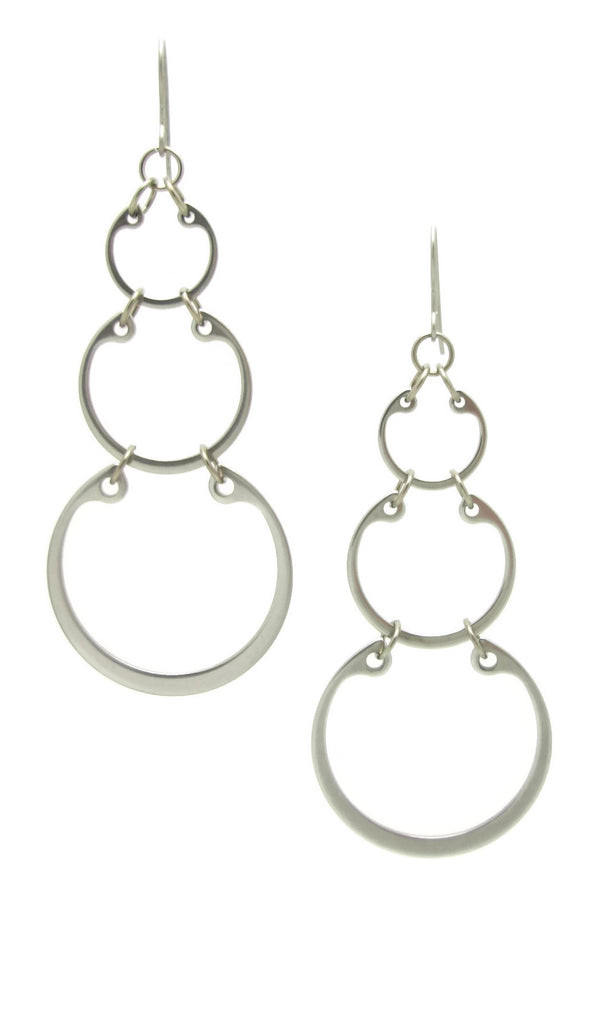 Graduated linked circles statement earrings by Wraptillion; always classic, never boring.
