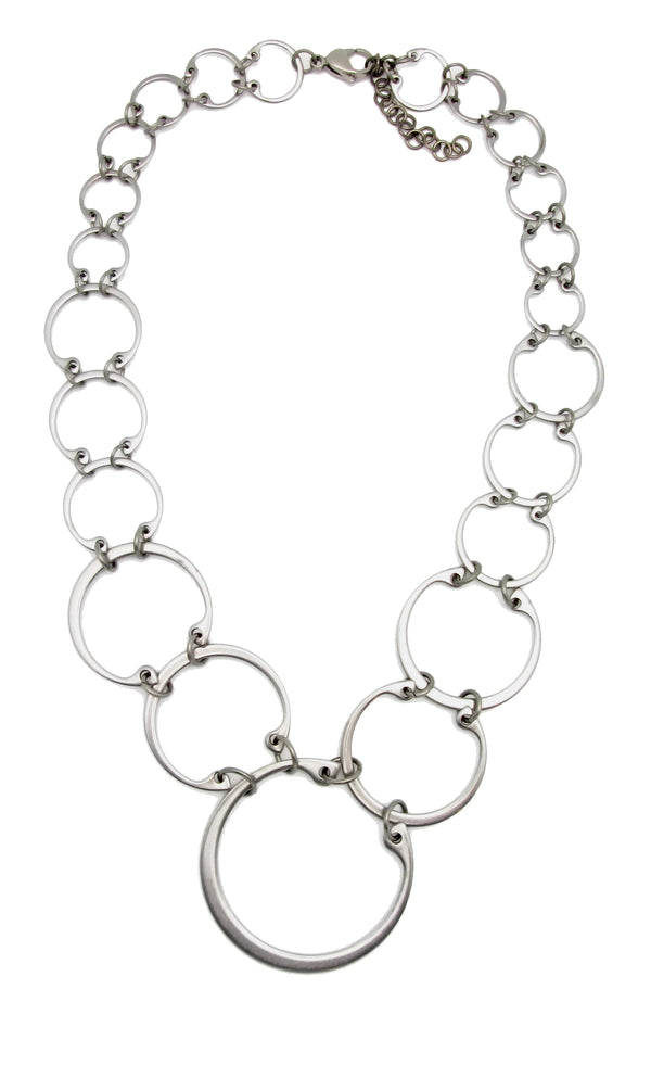 Graduated linked circles statement necklace by Wraptillion; always classic, never boring.